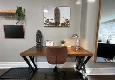 an office with a wooden desk and a chair at Rustic Elegance & Style 1BR in London
