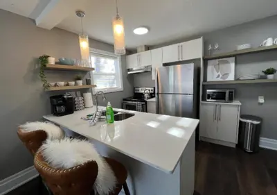 a kitchen with a white counter and a refrigerator at Rustic Elegance & Style 1BR in London