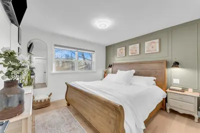 a bedroom with a large bed and a window at Luxury Family Home in Burlington in Burlington