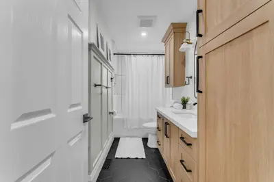 a bathroom with a white toilet and a sink at Luxury Family Home in Burlington in Burlington