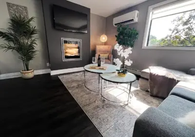a living room with a couch and a table at Elegant City Living - 1 BR in London