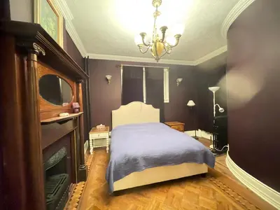 a bedroom with a bed and a chandelier at THE RED dragon in Niagara Falls