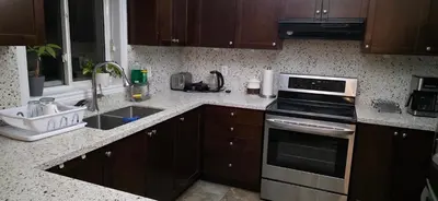 a kitchen with a sink and a stove top oven at short time rental in Kawartha Lakes
