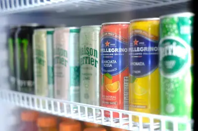 a row of cans of beer on a shelf at Stay Inn Muskoka in Gravenhurst