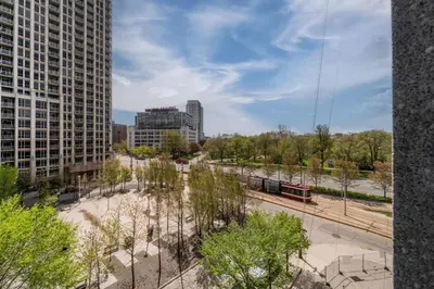 a view of a city with buildings and a train at Spacious 2 Bedroom plus Den, 2 Bath, Sleeps 5 with Balcony and Lakeview Downtown Toronto Condo in Toronto