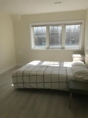 a bedroom with a bed in front of a window at 50% discount Amazing 3 Bedrooms Guest Suite in Richmond Hill