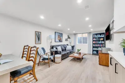 a living room with a couch and a table at Bright 2-Bedroom Apartment in Burlington