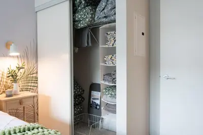 a closet in a bedroom with a mirror at Stylish Downtown Toronto Suite with Free Parking in Toronto