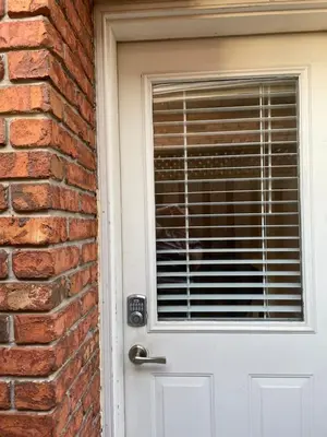 a brick wall with a door with a window at Private Suite in Niagara Falls in Niagara Falls