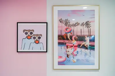 two framed pictures of a couple in a pool at Spa Oasis in Toronto's Heart-Free Parking! and Pet Friendly in Toronto