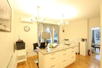 a kitchen with a counter top in a room at Xiao Wang in Toronto