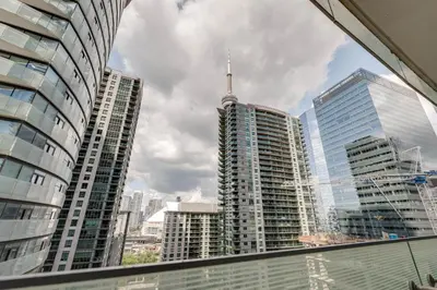 a view of a city skyline with tall buildings at RivetStays - The York in Toronto