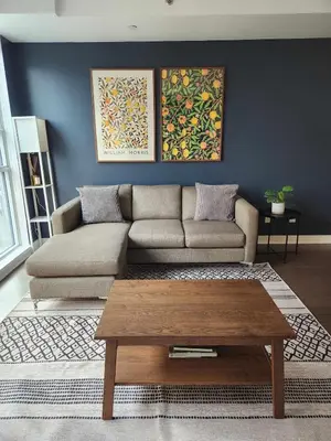 a living room with a couch and a coffee table at Queen St West Haven - Modern Loft, Downtown Toronto, Free Parking in Toronto