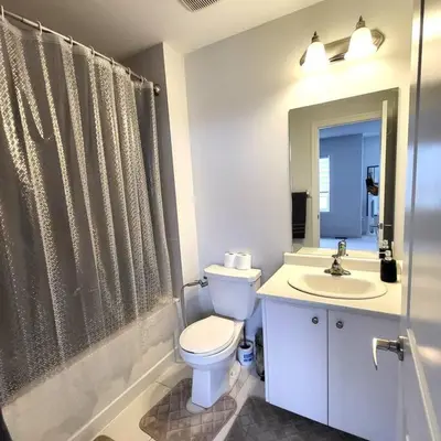 a bathroom with a toilet and a sink at Spacious 4 Bedroom House in Angus in Angus