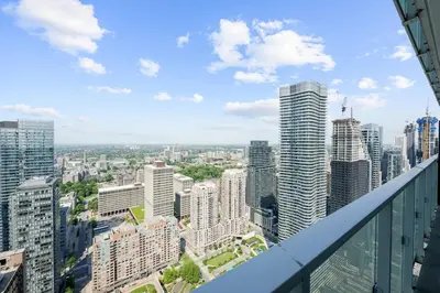 a view of a city with tall buildings at RentX Downtown 2-Bed Suite Gym WiFi in Toronto