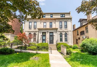 an apartment building with a pathway in front of it at Newly Renovated Modern Studio on James St South in Hamilton