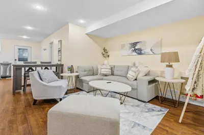 a living room with a couch and a table at Elegant & Private Apartment - Short Walk From Downtown in London