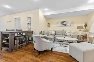 a living room with a couch and a table at Elegant & Private Apartment - Short Walk From Downtown in London