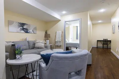 a living room with a couch and chairs and a table at Elegant & Private Apartment - Short Walk From Downtown in London