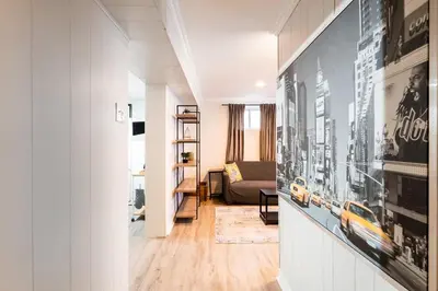 a hallway with a living room with a couch at Modern & Spacious 2BR 2BA Suite All Amenities Included in Brampton