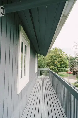 a porch of a house with a window at Sandbanks Cottage on Sheba's Island - 5 min drive, pet friendly in West Lake