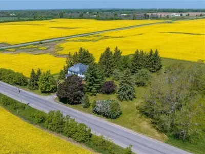 an aerial view of a house in the middle of a field at Golden Field Farmhouse - stayinpec on IG in Bloomfield