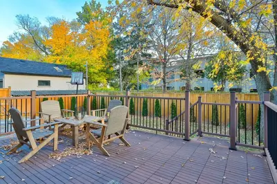a patio with a table and chairs and a fence at Comfortable Room in Toronto next to Yorkdale mall in Toronto