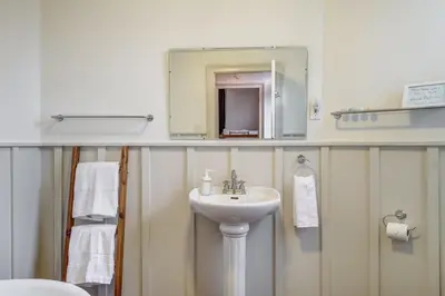 a bathroom with a sink and a mirror at The Marigold PEC Family Farmhouse country escape in West Lake