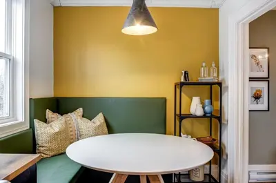 a room with a white table and a yellow wall at From HGTV Marigold Suite in county farmhouse in West Lake