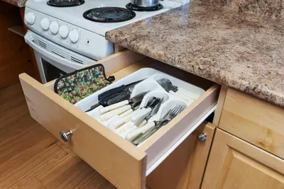 a drawer in a kitchen with utensils in it at Enjoy Relax at Rice Lakes in Bailieboro