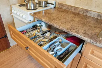 an open drawer in a kitchen with a sink at Enjoy The Outdoors at Rice Lakes in Bailieboro