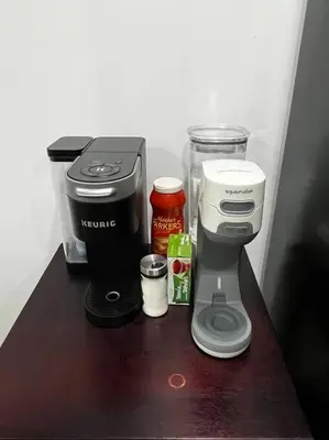 a counter with a coffee maker and other items on it at Brand new single unit guest basement apartment in Mississauga