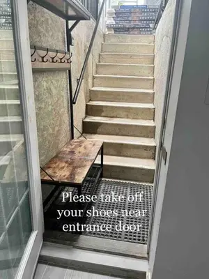 a stairway with a bench on it with a sign on it at Brand new single unit guest basement apartment in Mississauga