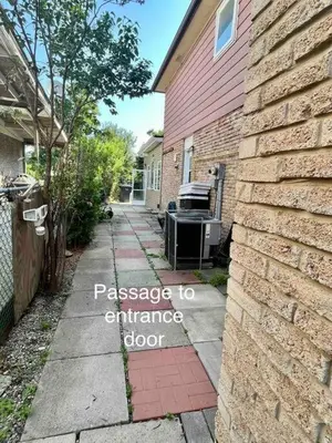 a house with a sign that reads passage to entrance door at Brand new single unit guest basement apartment in Mississauga