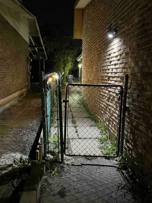 an entrance to a brick building with a gate at Brand new single unit guest basement apartment in Mississauga