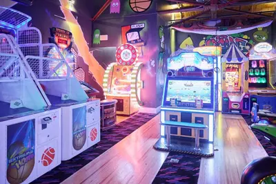 a room with a video game arcade with a video game console at Staybridge Suites St. Catharines Conf Ctr by IHG in St. Catharines