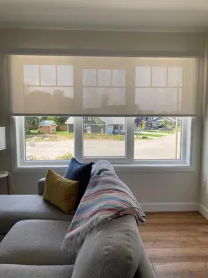 a living room with a couch and two windows at The Loft Retreat in Southampton