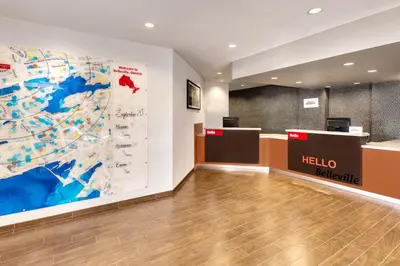 a lobby of a hotel with a map on the wall at TownePlace Suites by Marriott Belleville in Belleville