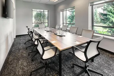 a conference room with a long table and chairs at TownePlace Suites by Marriott Belleville in Belleville