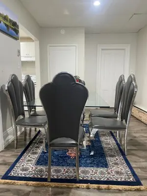 a row of chairs in a waiting room at Downtown Apartment 6-7 people in Bowmanville