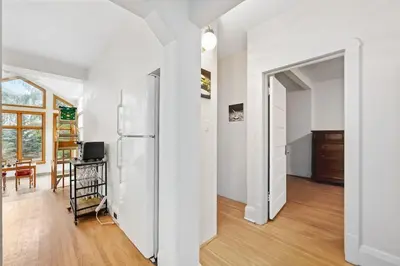 a kitchen with a refrigerator and a dining room at Picturesque & Serene Gem in Port Credit - Steps to Lake - Backyard in Mississauga