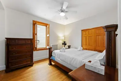 a bedroom with a bed and a dresser and a window at Picturesque & Serene Gem in Port Credit - Steps to Lake - Backyard in Mississauga