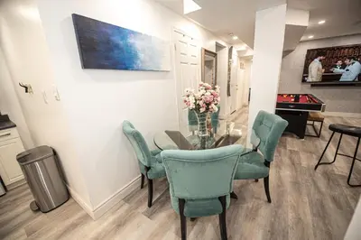 a dining room with a glass table and chairs at Luxury 2BR Guest Suite in Vaughan