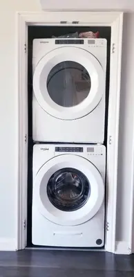 a white washer and dryer in a room at Elegant 2BR & 2BA Retreat in Prime Yorkville, Downtown in Toronto