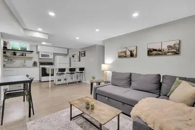 a living room with a couch and a table at Cosy Guest Suite Near Shops, Transit, Hwy and GO! in Mississauga