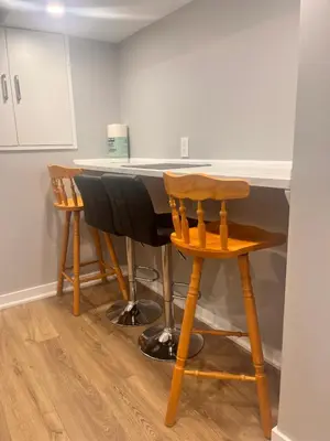 a kitchen with a table and two chairs at Bowmanville basement apartment in Bowmanville
