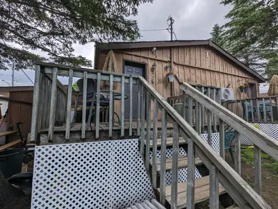 a wooden staircase leading up to a tiny house at Modern Tiny Wood Cottage 03 in Wasaga Beach
