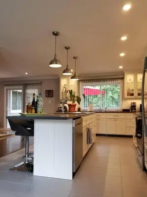 a large kitchen with a island in the middle at Alba Cottage with Brand New Pool in Queenston