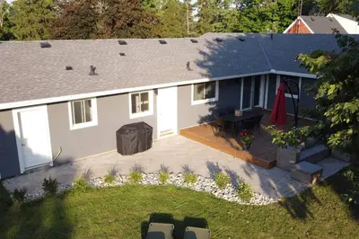 an aerial view of a house with a backyard at Alba Cottage with Brand New Pool in Queenston