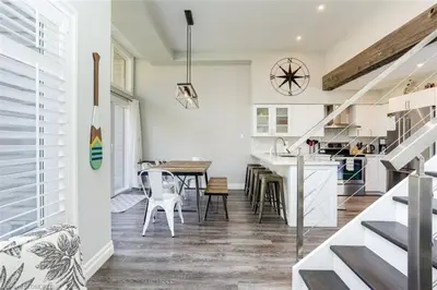 a kitchen and dining room with a table and chairs at The Family Escape Townhome in Collingwood